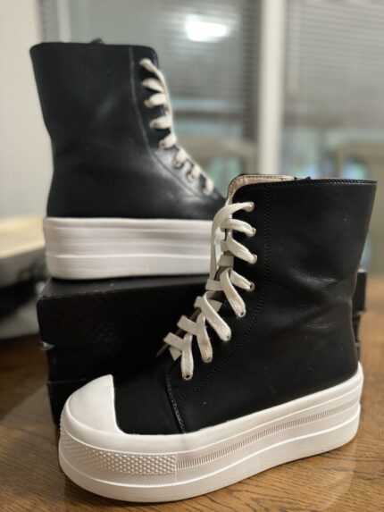 Tall, Black Platform Sneakers with White Laces. Perfect for all-weather wear. Stylish and comfortable.