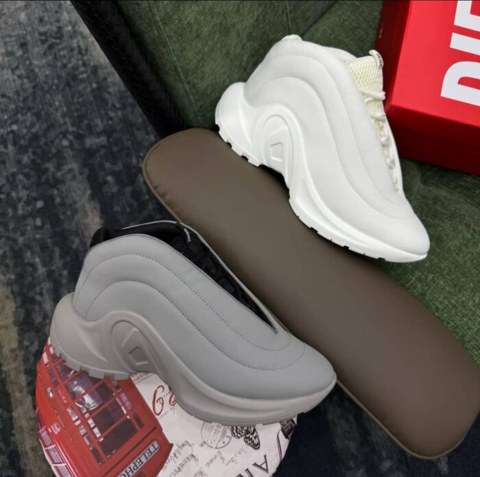 Tall, Stylish Sneakers for Nigerian Shoppers. Perfect for everyday wear, casual outings, or special events. Featuring a sleek, modern design with a mix of white and black colors. Available in various styles and sizes.