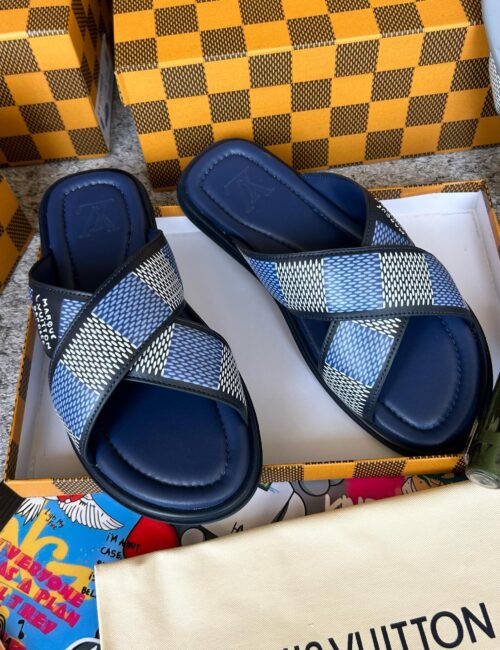 Luxury sandals with a modern, chic design. Featuring a bold blue and white checkered pattern, these sandals are the perfect choice for any wardrobe.