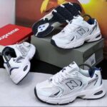 Nigerian-style sneakers with a sleek design and vibrant colors, perfect for everyday wear and sports. Featuring the iconic New Balance logo, these sneakers are the best in town.