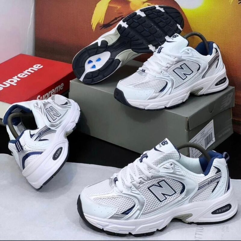 Nigerian-style sneakers with a sleek design and vibrant colors, perfect for everyday wear and sports. Featuring the iconic New Balance logo, these sneakers are the best in town.