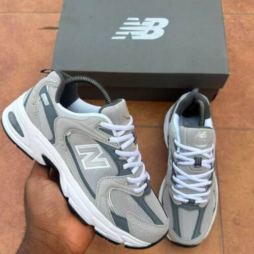 Sneakers in a gray and white colorway, perfect for everyday wear or special occasions. Designed for comfort and style, the New Balance 800 is a must-have for any Nigerian shopper.
