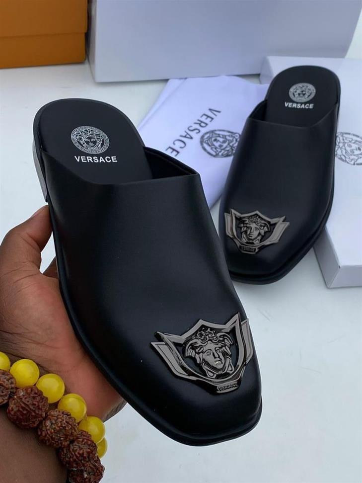 Sophisticated and daring, the Black Versace Leather Half-Shoe redefines luxury with bold design and premium craftsmanship.