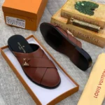 The Brown LV Mules Half-Shoe blends Louis Vuitton’s signature sophistication with the ease of modern slip-on design. Crafted from premium brown leather and featuring iconic LV detailing, this half-shoe offers a luxurious finish with a relaxed, open-back silhouette. Its padded insole and sleek construction ensure all-day comfort, while the timeless brown tone pairs effortlessly with both smart and casual outfits. A perfect fusion of heritage style and contemporary ease, this mule is an understated yet powerful addition to any refined wardrobe.