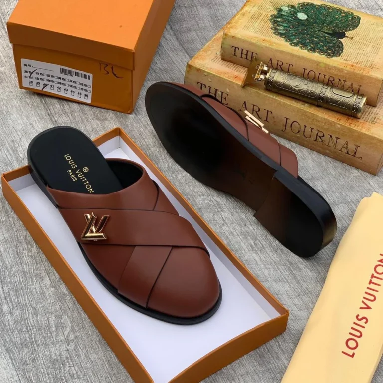 The Brown LV Mules Half-Shoe blends Louis Vuitton’s signature sophistication with the ease of modern slip-on design. Crafted from premium brown leather and featuring iconic LV detailing, this half-shoe offers a luxurious finish with a relaxed, open-back silhouette. Its padded insole and sleek construction ensure all-day comfort, while the timeless brown tone pairs effortlessly with both smart and casual outfits. A perfect fusion of heritage style and contemporary ease, this mule is an understated yet powerful addition to any refined wardrobe.