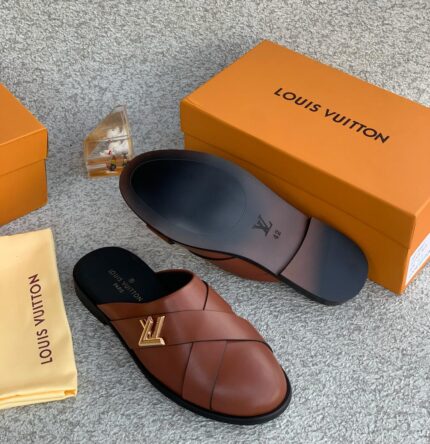 The Brown LV Mules Half-Shoe blends Louis Vuitton’s signature sophistication with the ease of modern slip-on design. Crafted from premium brown leather and featuring iconic LV detailing, this half-shoe offers a luxurious finish with a relaxed, open-back silhouette. Its padded insole and sleek construction ensure all-day comfort, while the timeless brown tone pairs effortlessly with both smart and casual outfits. A perfect fusion of heritage style and contemporary ease, this mule is an understated yet powerful addition to any refined wardrobe.