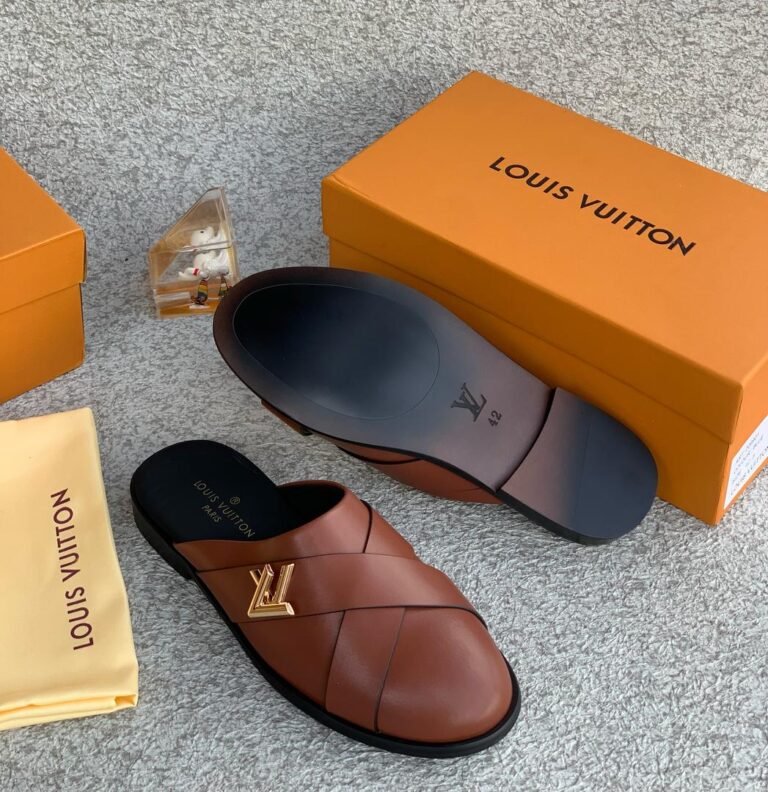 The Brown LV Mules Half-Shoe blends Louis Vuitton’s signature sophistication with the ease of modern slip-on design. Crafted from premium brown leather and featuring iconic LV detailing, this half-shoe offers a luxurious finish with a relaxed, open-back silhouette. Its padded insole and sleek construction ensure all-day comfort, while the timeless brown tone pairs effortlessly with both smart and casual outfits. A perfect fusion of heritage style and contemporary ease, this mule is an understated yet powerful addition to any refined wardrobe.