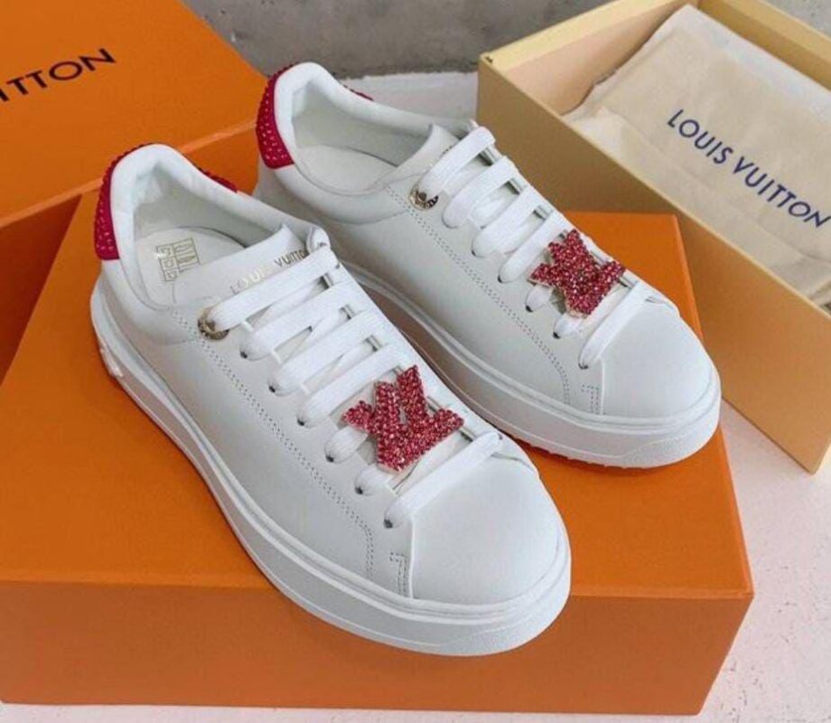Louis Vuitton Time Out sneaker with a red and white diamond-encrusted logo, perfect for any occasion. Available in various sizes and styles.