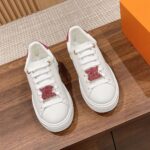 Louis Vuitton Time Out sneaker with a red and white diamond-encrusted logo, perfect for any occasion. Available in various sizes and styles.