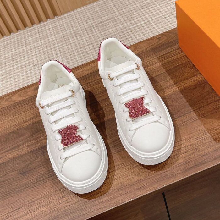 Louis Vuitton Time Out sneaker with a red and white diamond-encrusted logo, perfect for any occasion. Available in various sizes and styles.