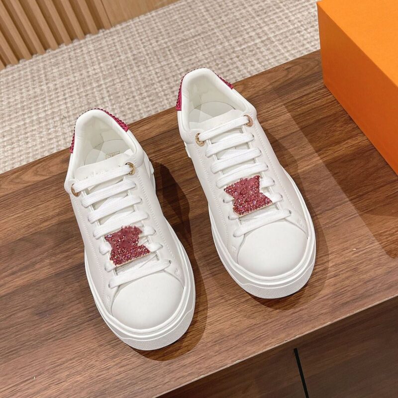 Louis Vuitton Time Out sneaker with a red and white diamond-encrusted logo, perfect for any occasion. Available in various sizes and styles.
