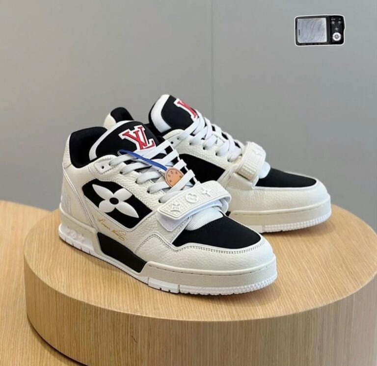 The LV Low-Neck Buckle Sneakers combine Louis Vuitton's iconic luxury with urban edge, featuring premium materials, signature monogram details, and a sleek buckle-fastened design for elevated street style.