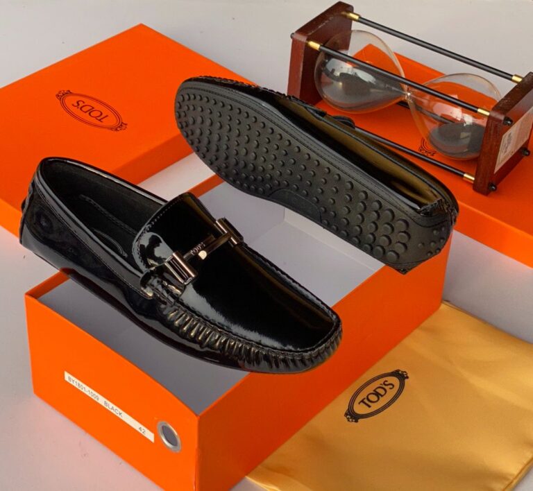 The Tod's Black Espadrille Loafer merges Italian craftsmanship with effortless style, featuring a sleek silhouette and signature espadrille-inspired sole for laid-back sophistication.