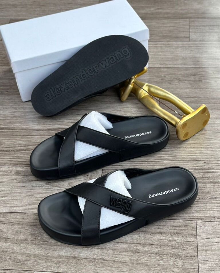 High-quality, stylish sandals with a modern design. Ideal for everyday wear or special occasions. Available in black leather and white contrasting inner sole.